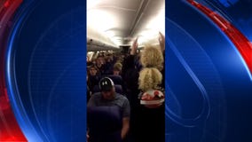 MUSIC TO THE EARS: Saguaro High School choir gave airline passengers a surprise in the air