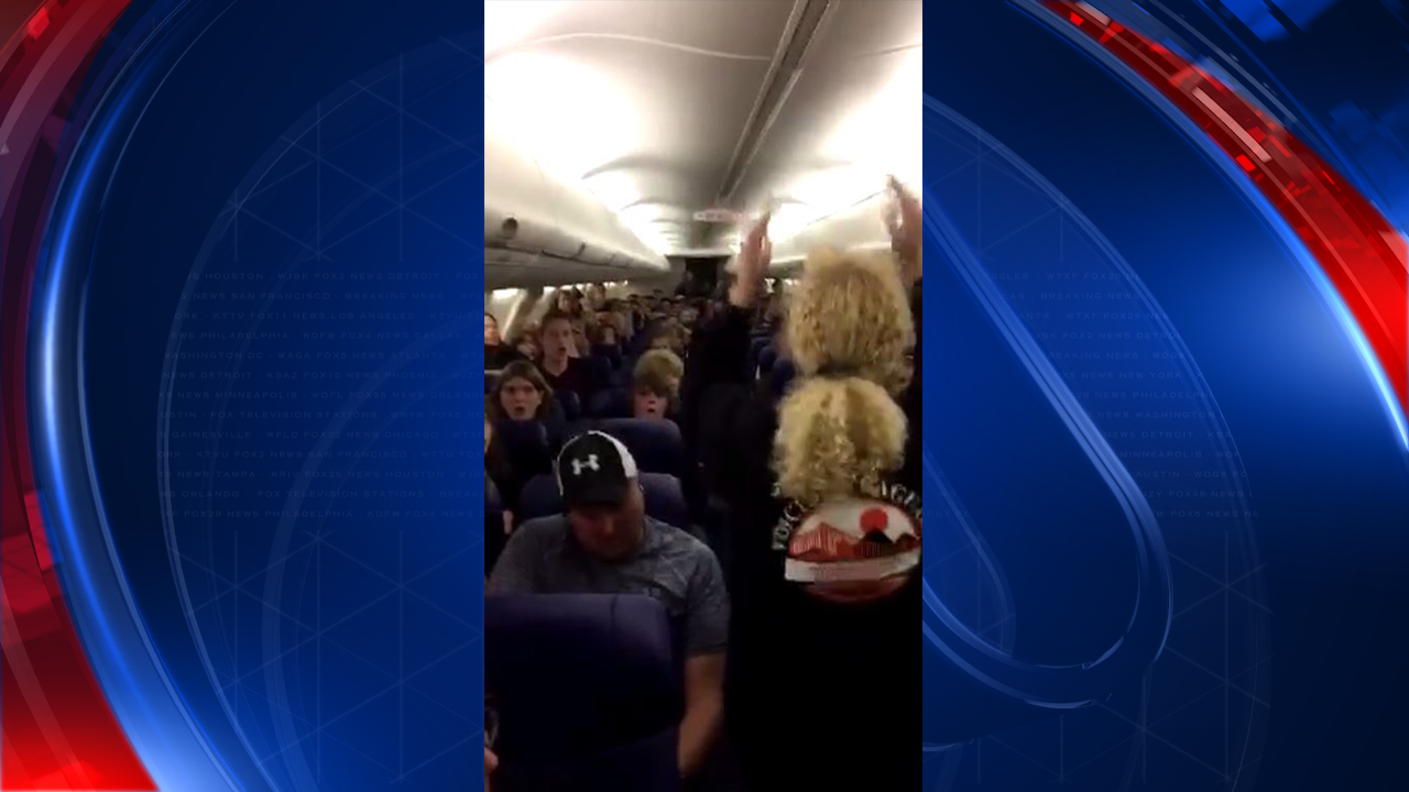 MUSIC TO THE EARS: Saguaro High School choir gave airline passengers a surprise in the air