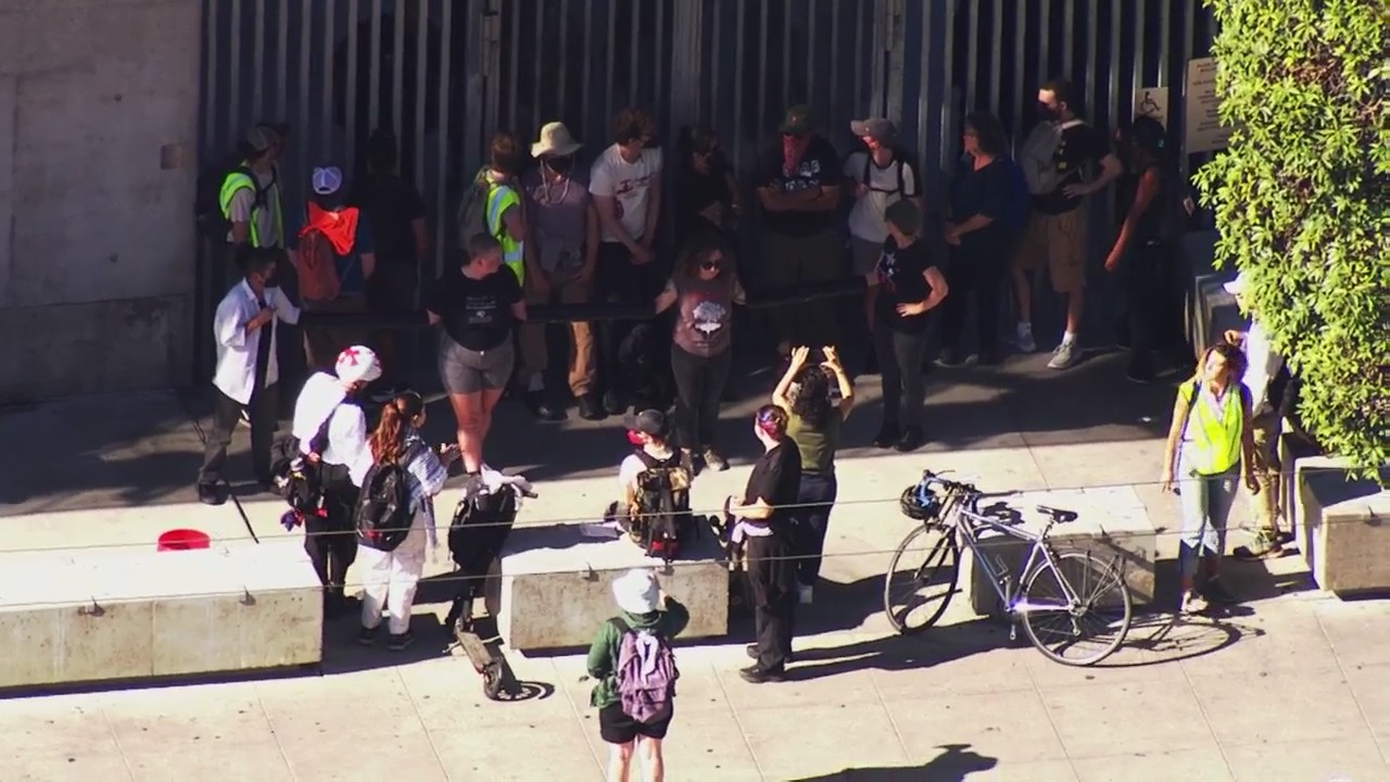 Protesters chain themselves together outside of SF federal building ...