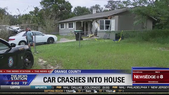 Children nearly hit when car crashes into home