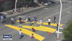 Artists paint massive message on the streets of Richmond