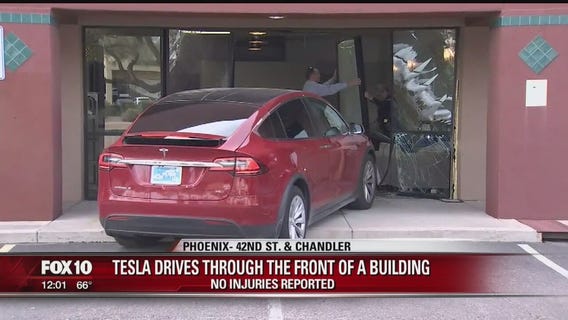 Tesla driver crashes into Phoenix business