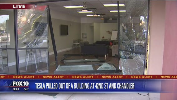 Tesla crashes into Chandler building