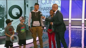 Quincy chats with the children of The Q