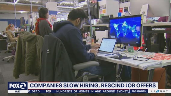 Companies slow hiring, rescind job offers