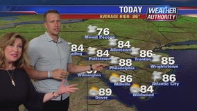 Nick Foles helps Sue Serio with the weather