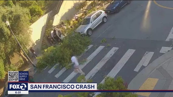 Car lands upside down after crashing through San Francisco barrier