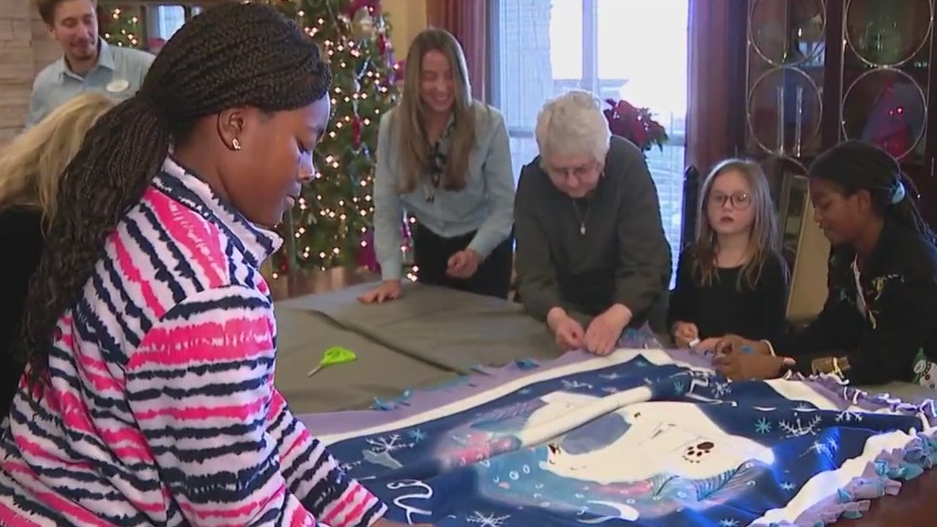 Seniors make blankets with students