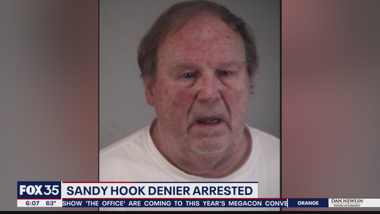 Sandy Hook denier charged with having victim's dad's ID info