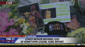 Memorial forms outside of Bryant Gymnasium at Lower Merion High School
