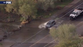 Closed flooded road doesn't stop Phoenix drivers