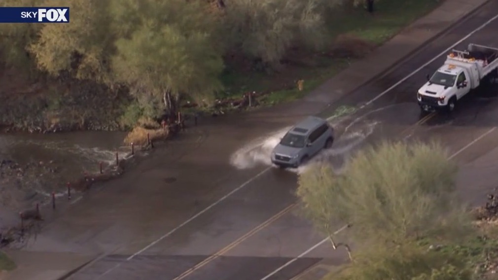 Closed flooded road doesn't stop Phoenix drivers