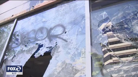 Small business owners in Oakland spend their Saturday cleaning up