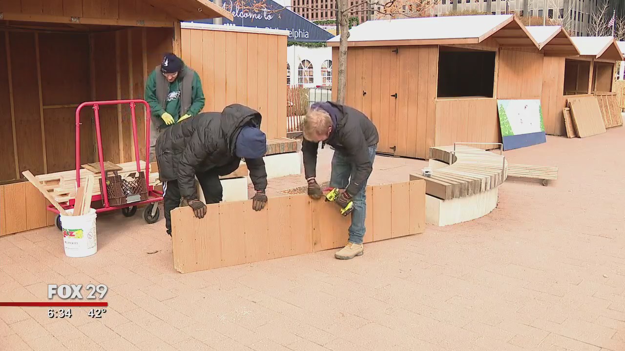 Workers like elves setting up Christmas Village in Philadelphia