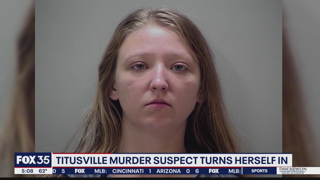 Titusville murder suspect turns herself in