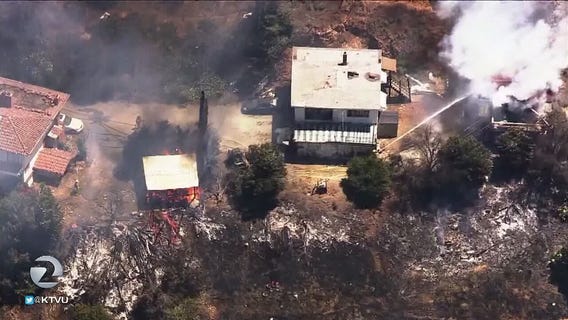 Grass fire in San Jose threatens homes, structures