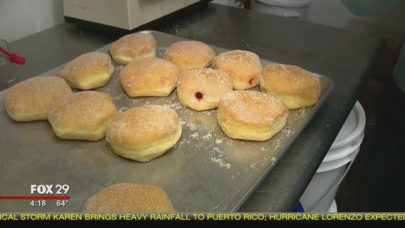 Bob Kelly fills jelly donuts at Angelina's Bake Shop
