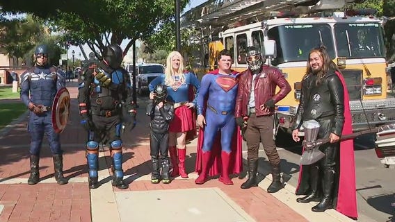 Superheroes parade in Glendale delivers toys, supplies for Family Advocacy Center