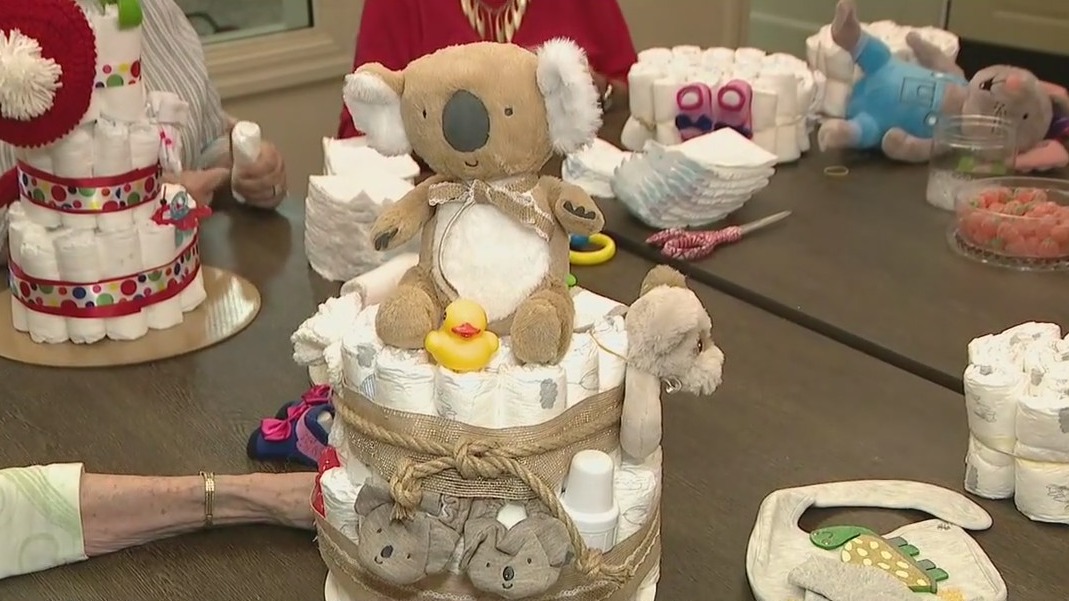 Surprise seniors make diaper cakes, knit hats and blankets for babies