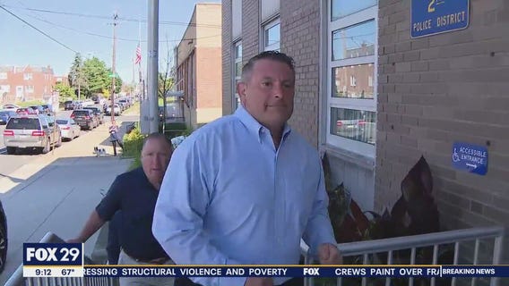 Inspector Bologna surrenders after being charged with striking protester