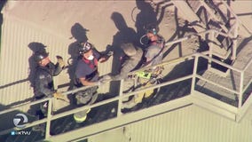 Firefighters rescue man trapped in cement hopper for 2.5 hours