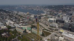 Space Needle Panocam installation shows worker atop spire of Seattle landmark