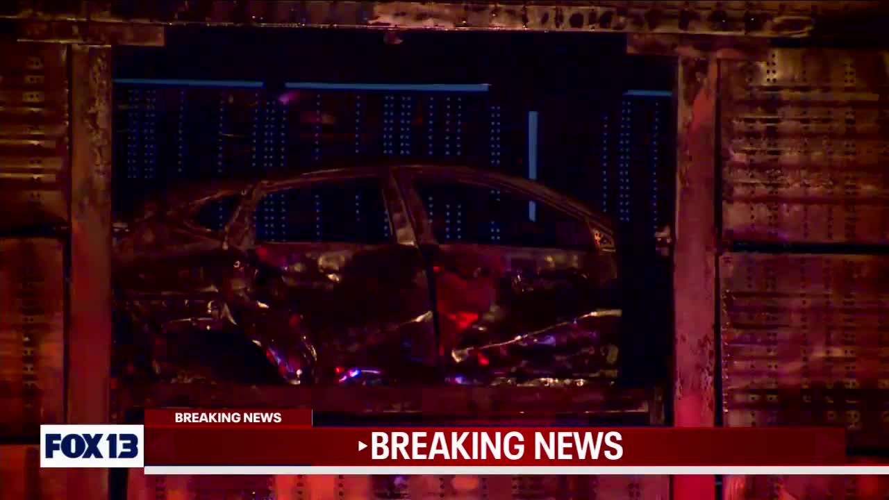 Train car full of vehicles catches on fire in Tacoma