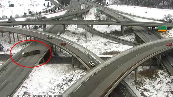 Dump truck slams into overpass in Stadium Interchange