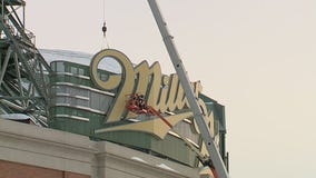 Crews begin to remove large Miller Park sign from stadium