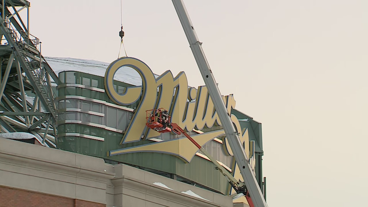 Crews begin to remove large Miller Park sign from stadium
