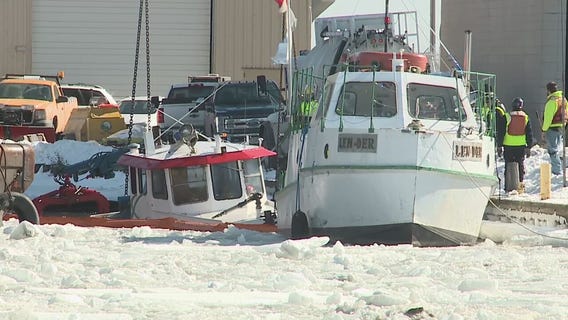 Crews bring tugboat from river bottom in Milwaukee