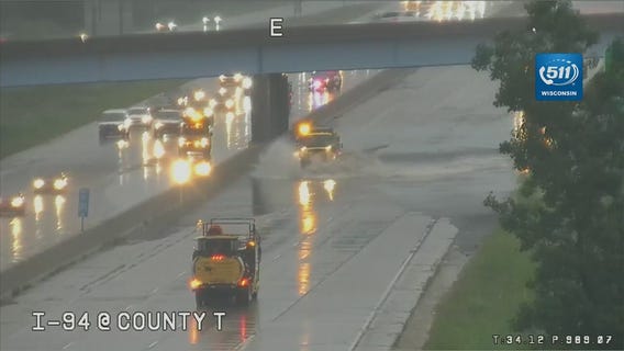 Snow plows used to help clear rainwater from interstate