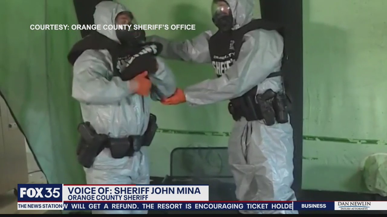 Orange County deputies wear protective clothing when responding to COVID-19 calls