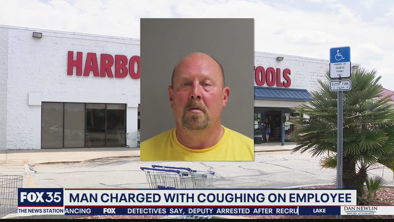 Man charged with coughing on employee