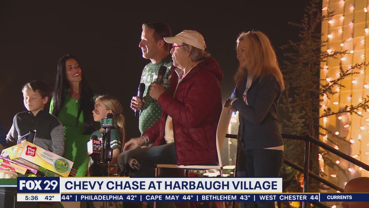 Chevy Chase visits Harbaugh Village lights display