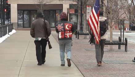 Heavy fortified statehouses around the US see small protests
