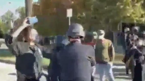 Police and protesters scuffle outside Mayor Garcetti's home