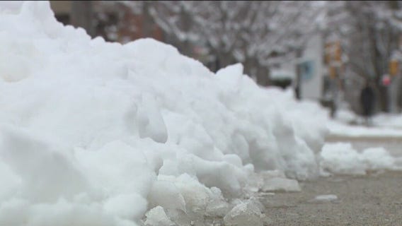 Wisconsin winter storm; cleanup phase includes snow, leaves