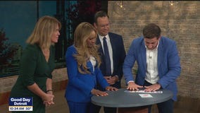 Magician Anthony Grupido does a card trick