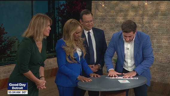 Magician Anthony Grupido does a card trick