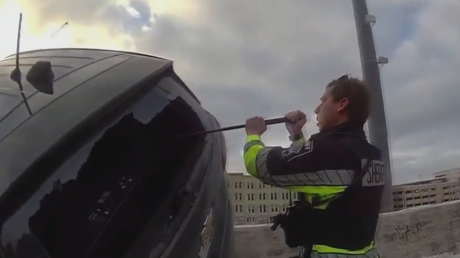 Cars piled up against Milwaukee freeway retaining wall