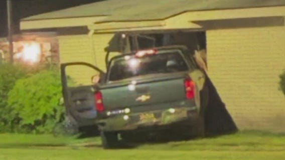 Truck crashes into Pontiac apartment, narrowly missing three children