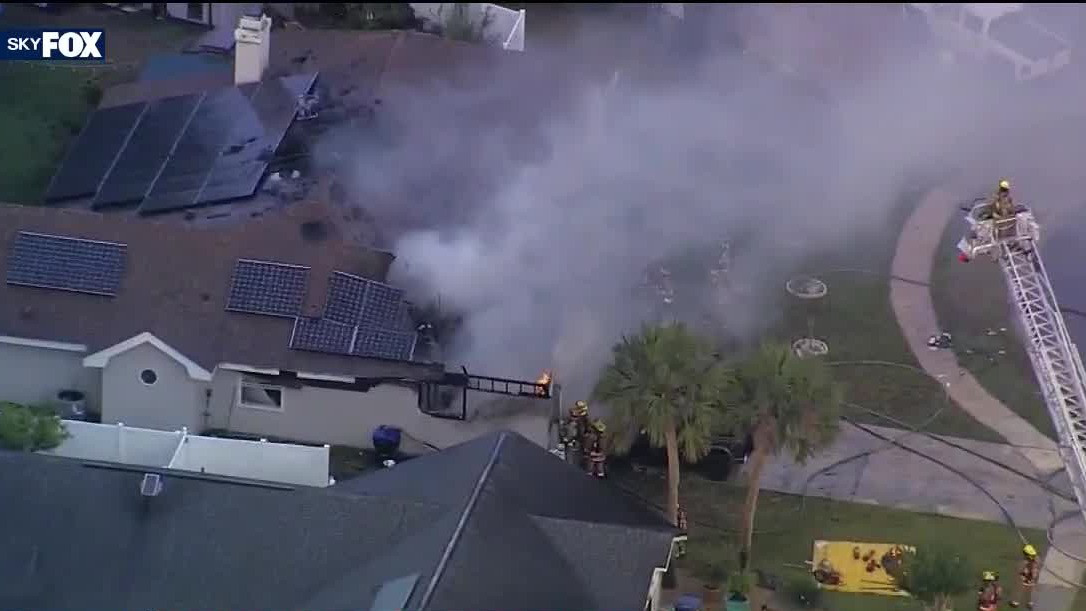 Firefighters battling house fire in Orange County