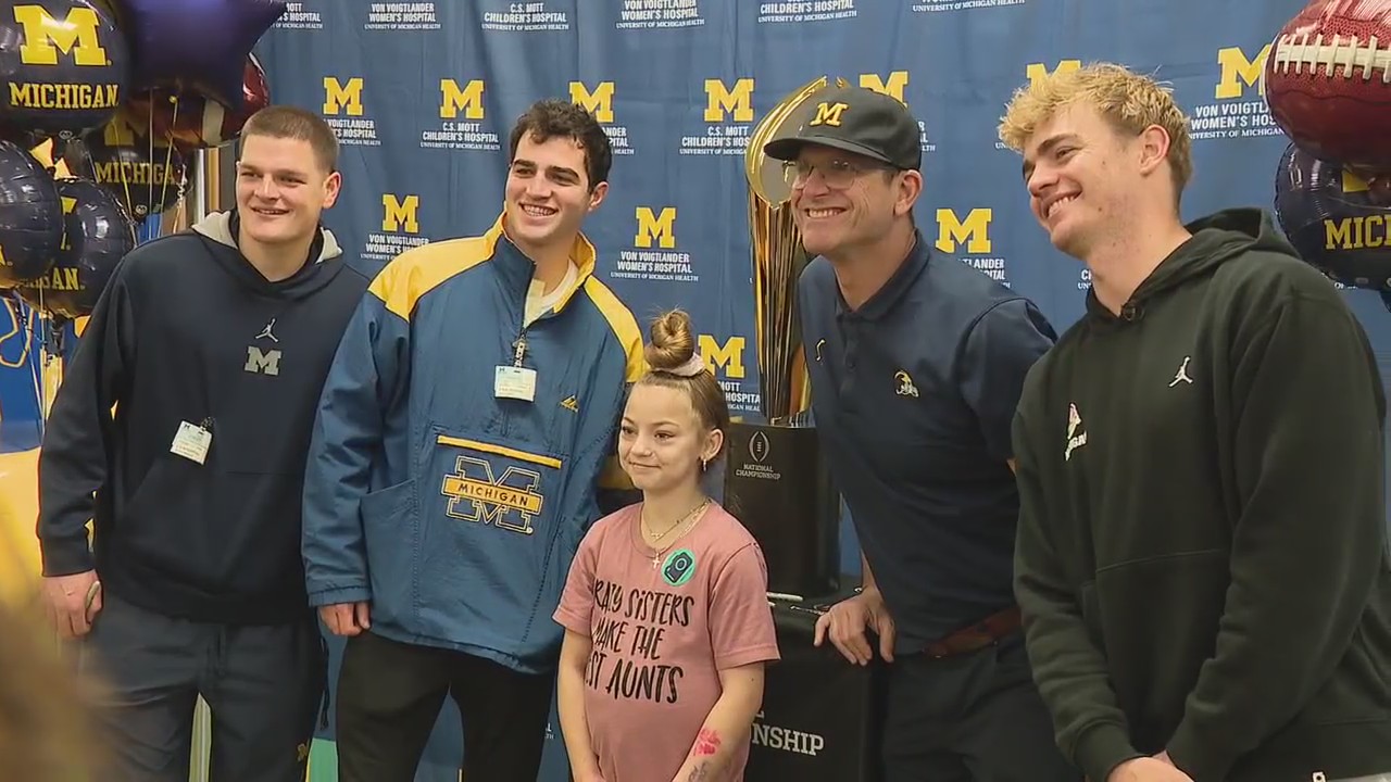 Michigan's Jim Harbaugh, team members visit CS Mott's Children's Hospital