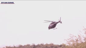 Search continues for man swept away by floodwaters