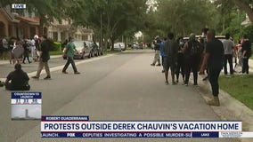 Protesters gather outside Derek Chauvin's Windermere home