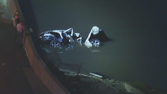 Car plunges into water off freeway amid wet conditions