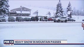 Heavy snow falling at WA mountain passes