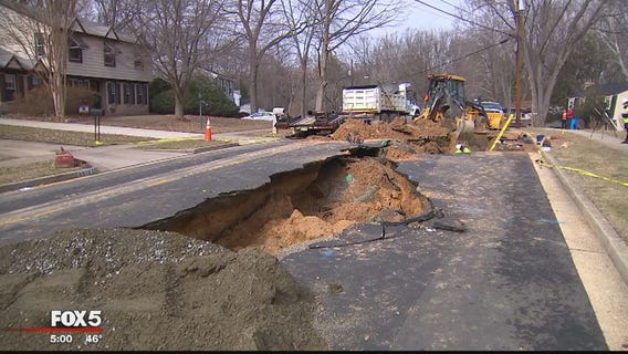 Crews working to repair massive sinkhole in Fairfax County road