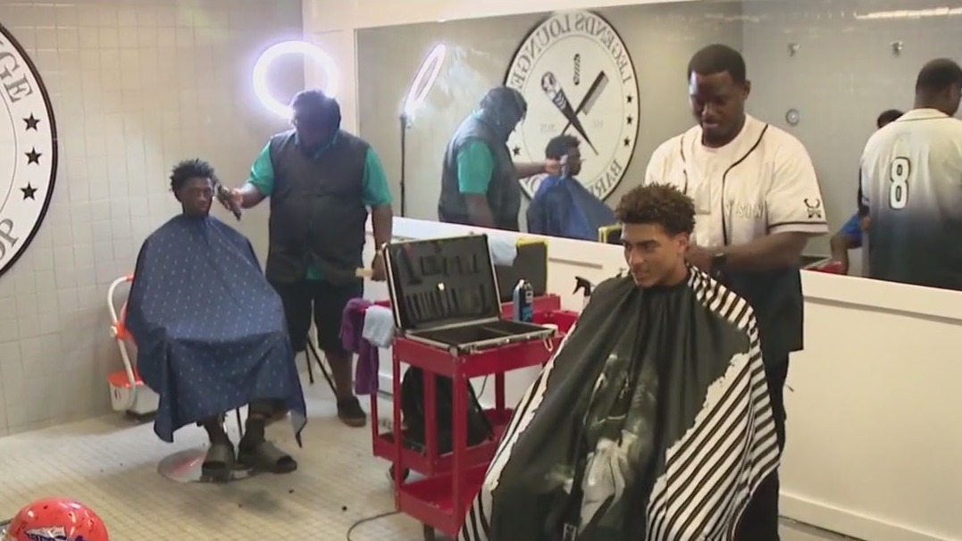 Football team build barbershop in locker room